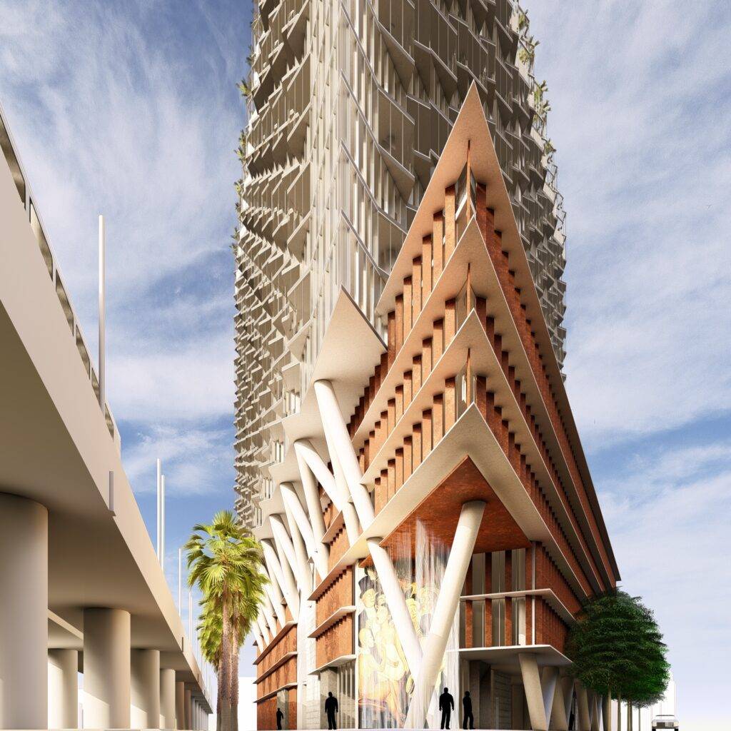 Modern architectural skyscraper with unique geometric design against a blue sky.
