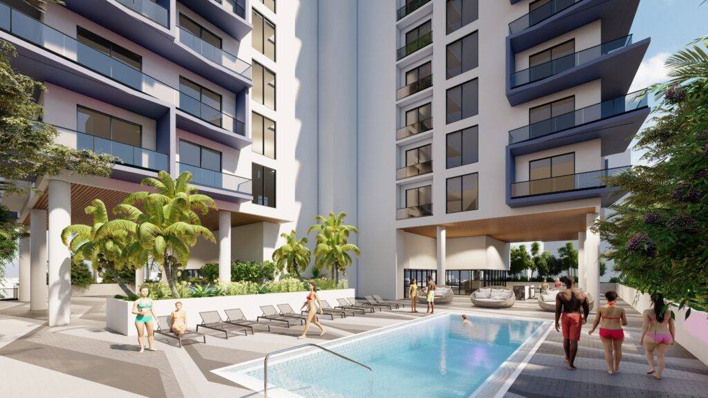 Modern apartment complex with poolside view and lush palm trees.