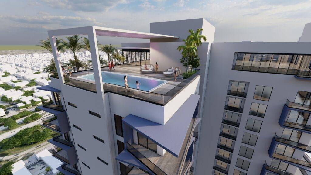 Rooftop pool terrace on a modern high-rise with city views and palm trees.