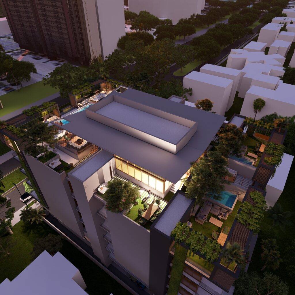 Aerial view of a modern, illuminated building at night with lush rooftop gardens and surrounding trees.