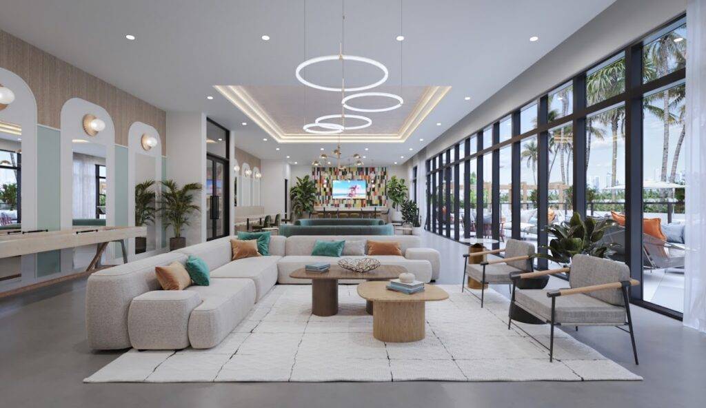 Modern lounge area with sleek white sofas, circular ceiling lights, and large windows offering a view of palm trees.