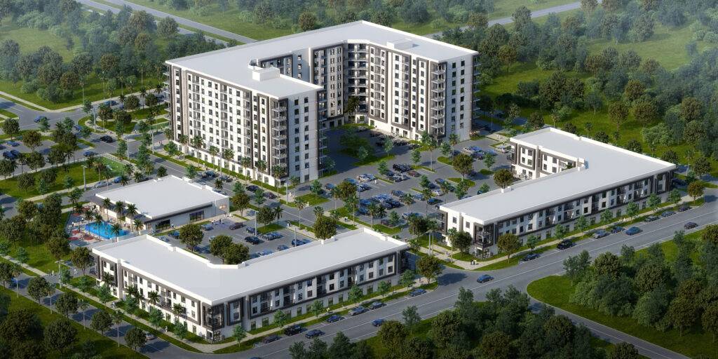 Aerial view of a modern apartment complex surrounded by lush greenery.