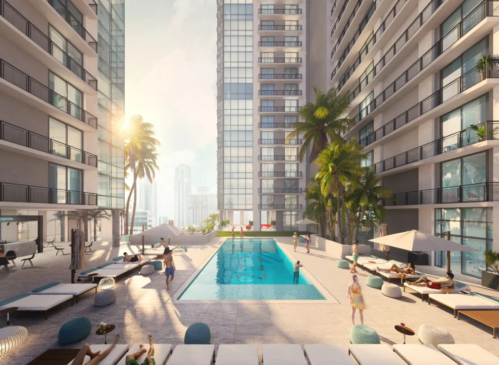 Luxurious urban apartment complex with pool and palm trees bathed in sunset light