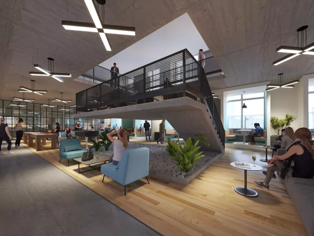 Modern office lobby with sleek furniture, open stairway, and vibrant lighting.