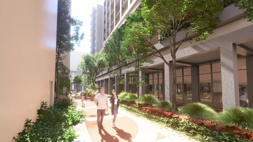 Modern apartment building with lush greenery and people walking along a sunlit path.