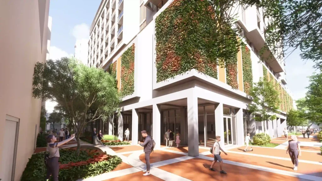 Modern building facade with vertical greenery and pedestrians walking on a sunny day.