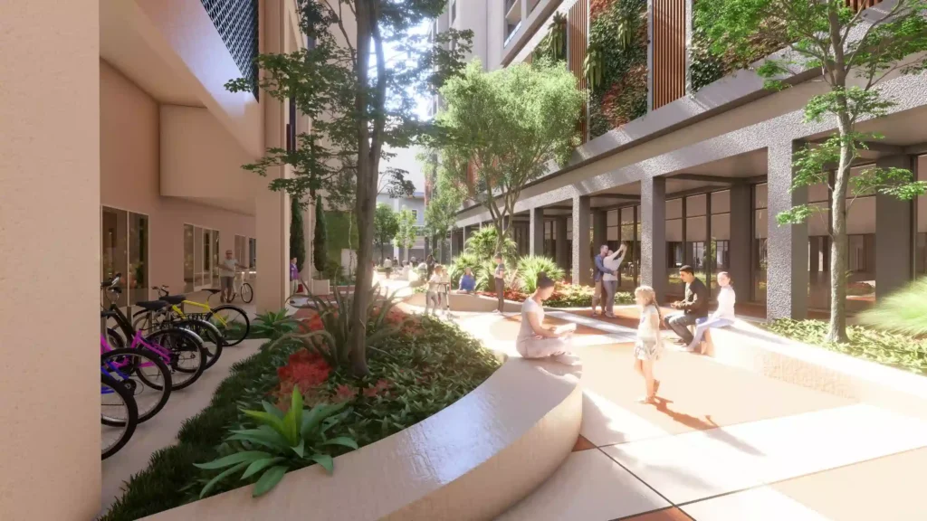 Modern courtyard with lush greenery and bicycles parked on the side.