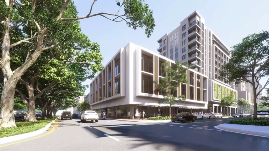 Modern architectural building surrounded by lush trees and urban streets.