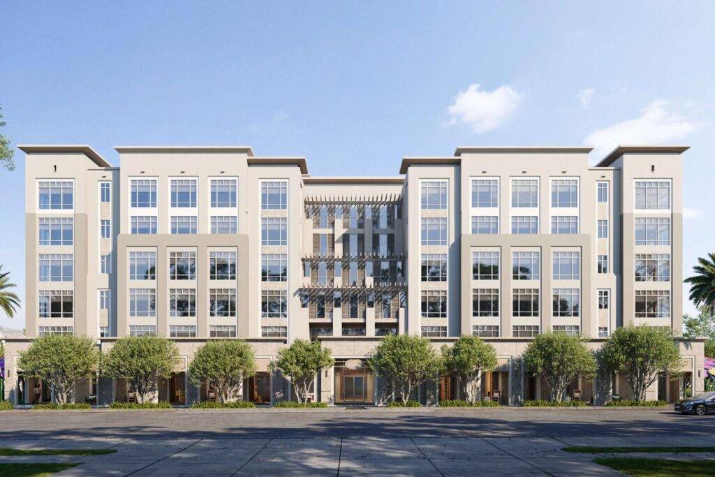 Modern six-story commercial building with large windows and trees lining the street.