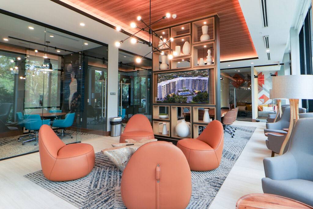 Modern office lounge with orange seating and stylish decor