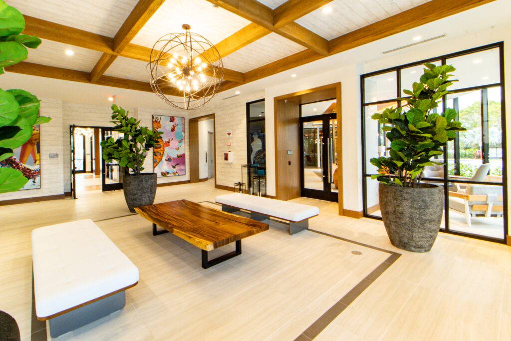 Modern lobby with wooden accents, stylish seating, and elegant lighting.