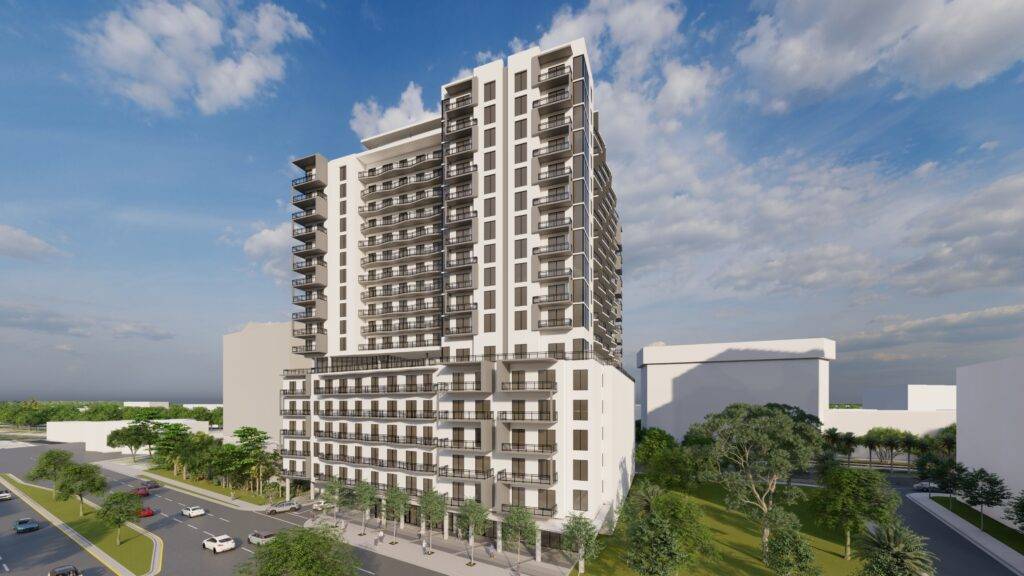 Modern high-rise building in urban landscape with blue sky and clouds