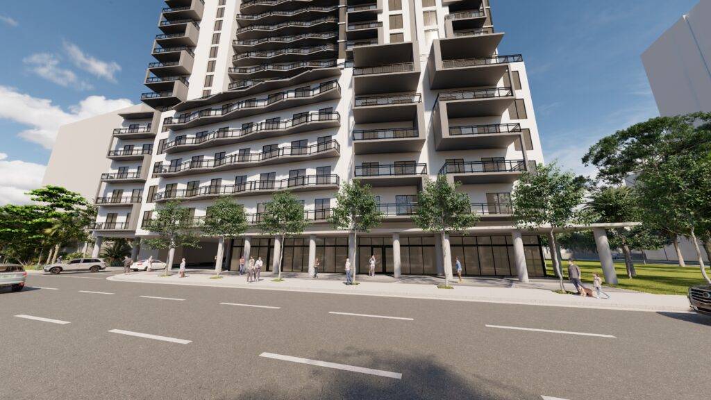 Modern high-rise building with balconies and street view.