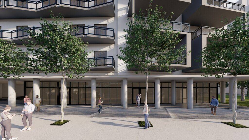 Modern apartment building facade with balconies and trees.