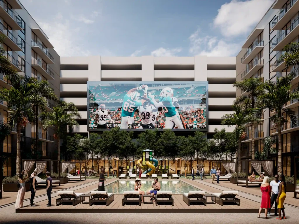 Modern apartment courtyard with pool, lounge chairs, and a large sports-themed mural.