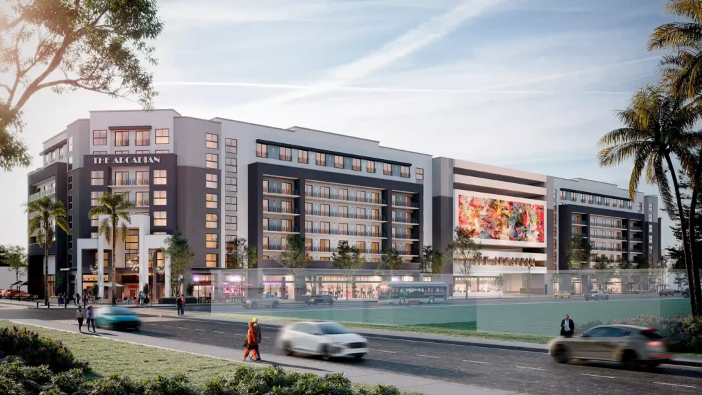 Modern luxury apartment building with sleek design and palm trees.