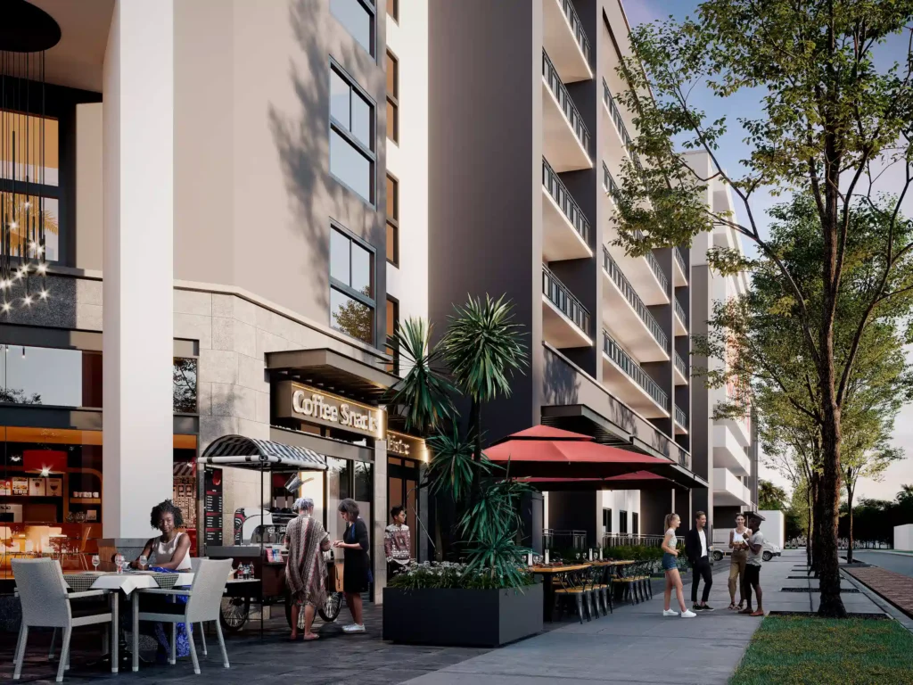 Modern apartment building with street-level cafes and outdoor seating.