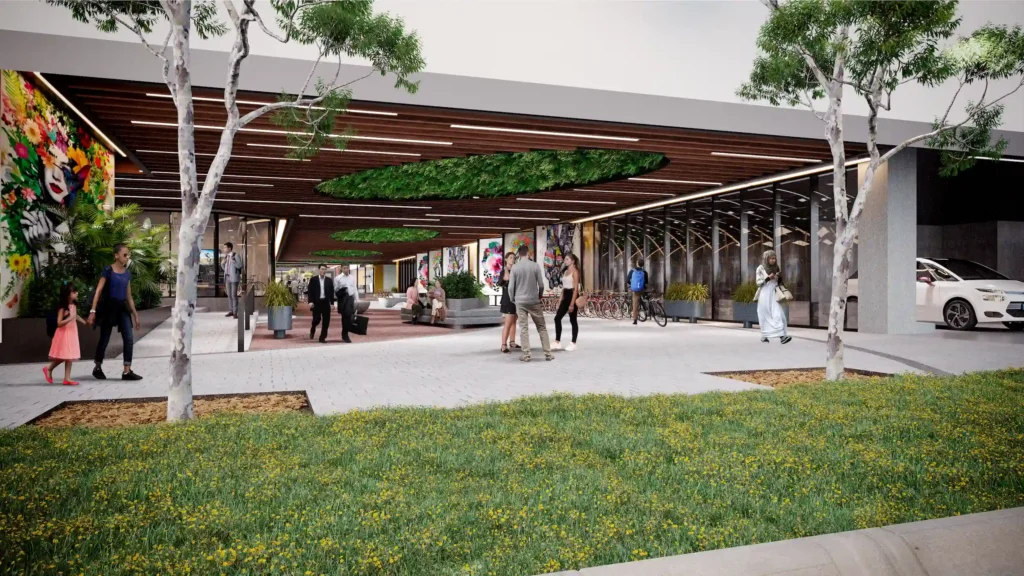 Modern architectural design of an open plaza with vibrant murals and greenery.