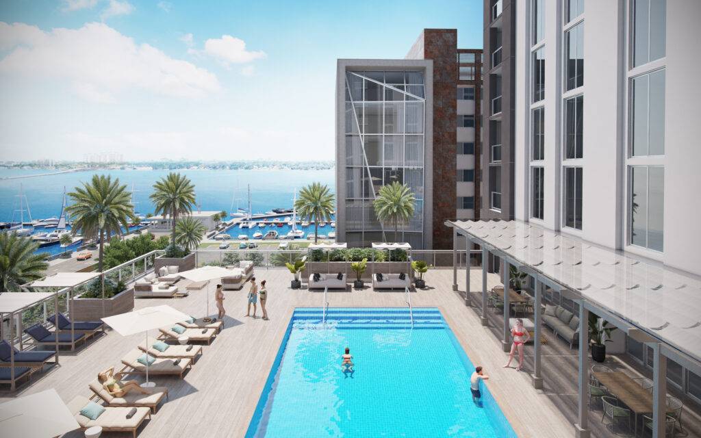 Luxurious poolside view at a coastal resort with modern architecture and palm trees.
