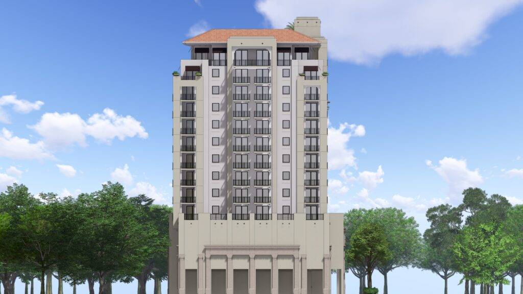 Modern high-rise building with Mediterranean design against a blue sky.