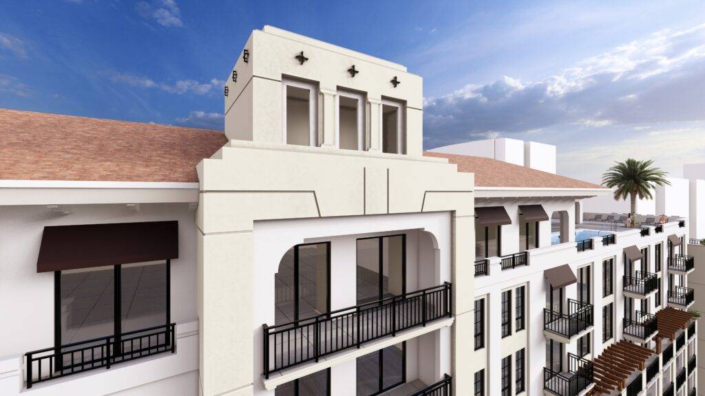 White modern building with balconies and a tile roof under a blue sky.