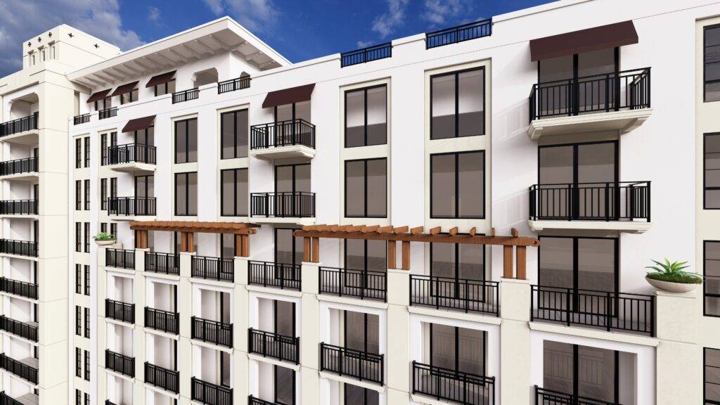 Modern apartment building with balconies and sleek design against a blue sky.