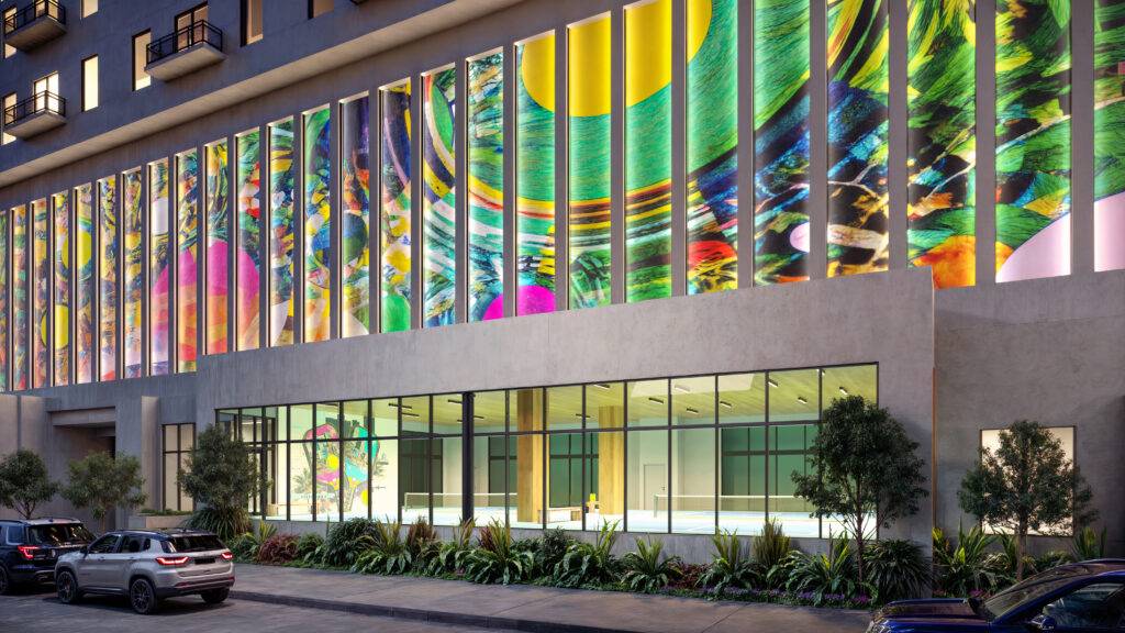 Colorful architectural design with vibrant mural on modern building exterior.