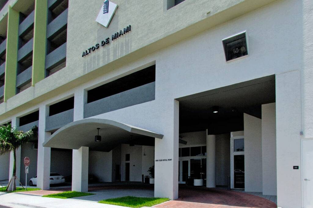 Modern facade of Altos de Miami building with minimalist architecture.