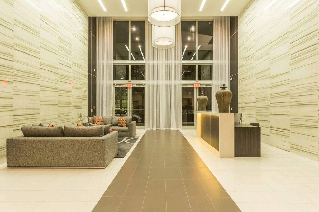 Elegant modern lobby with high ceilings, chic sofas, and stylish lighting.