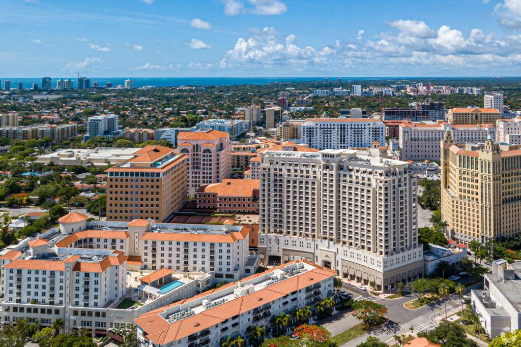 Aerial view of Columbus Center with surrounding cityscape and ocean in Coral Gables.