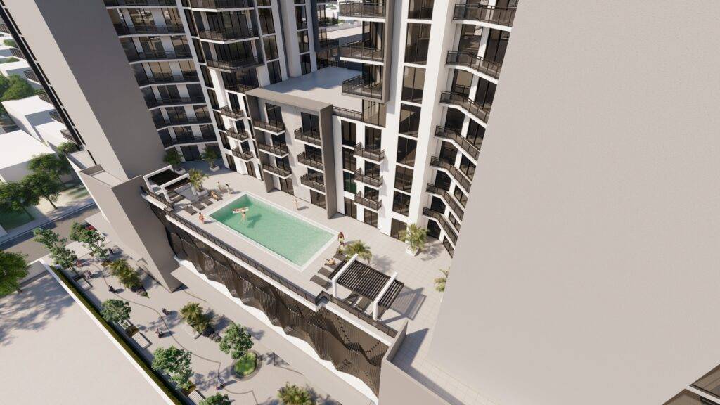 Aerial view of modern apartment complex with a central swimming pool and stylish terraces.