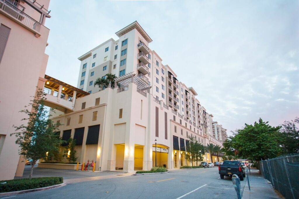 Modern apartment buildings with elegant architecture and lush greenery.