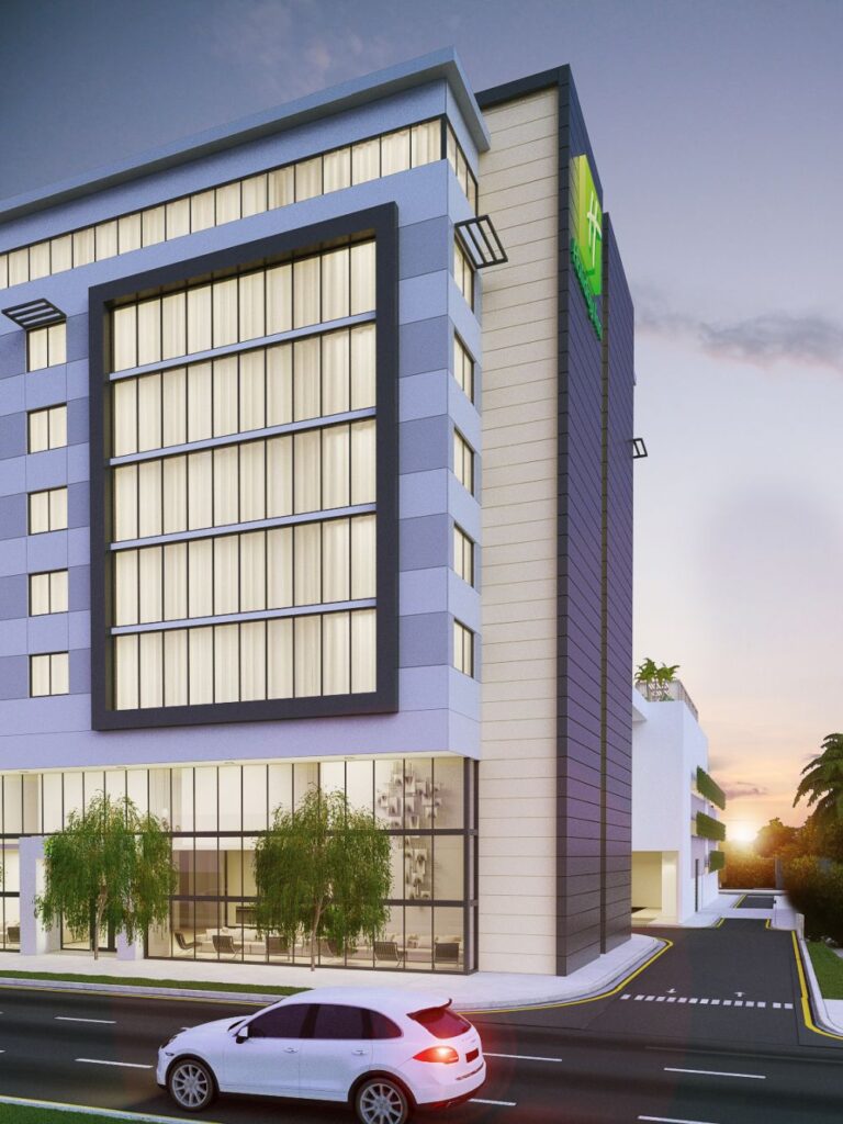 Modern Holiday Inn building with sleek design in Fort Lauderdale at sunset.