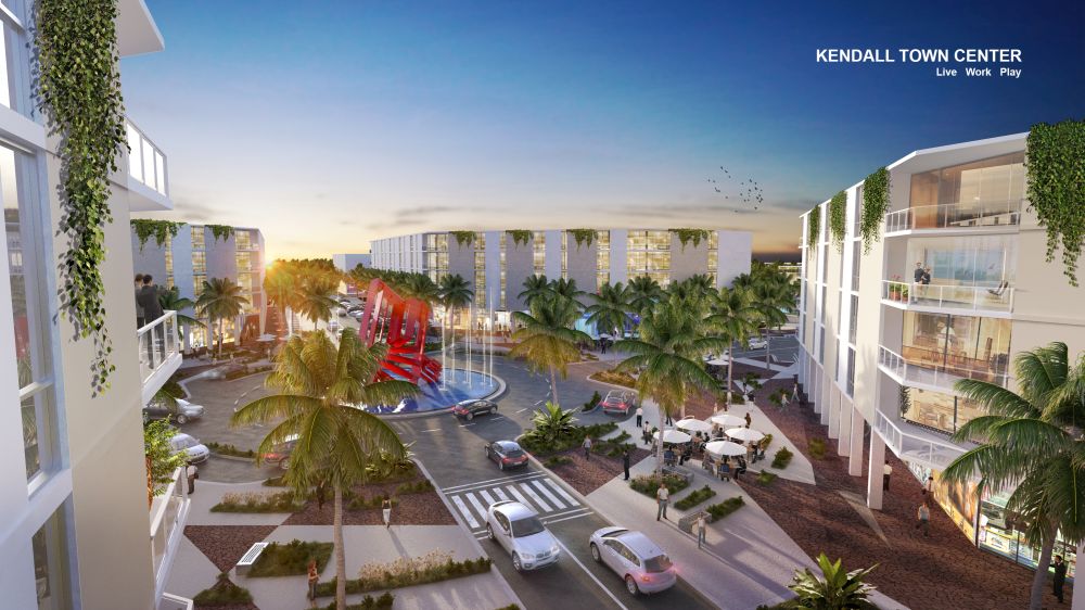 Aerial view of Kendall Town Center at sunset, featuring lush greenery, modern buildings, and palm-lined streets.