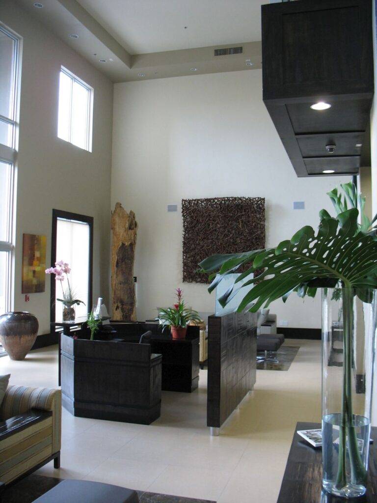 Modern executive plaza lobby with high ceilings, elegant decor, and stylish furniture.