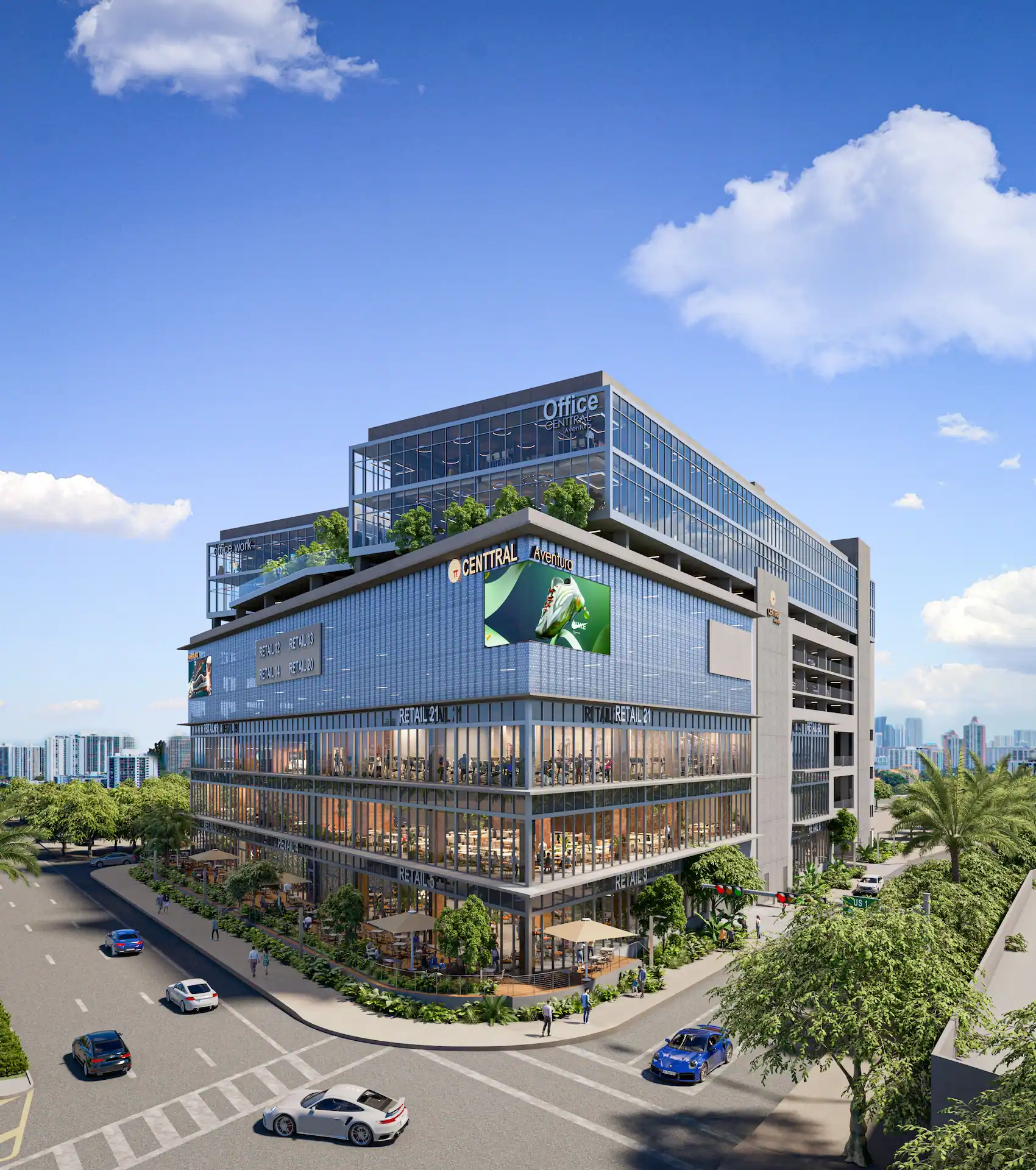 Modern multi-story office building with glass facade against a clear blue sky, surrounded by lush greenery in an urban setting.