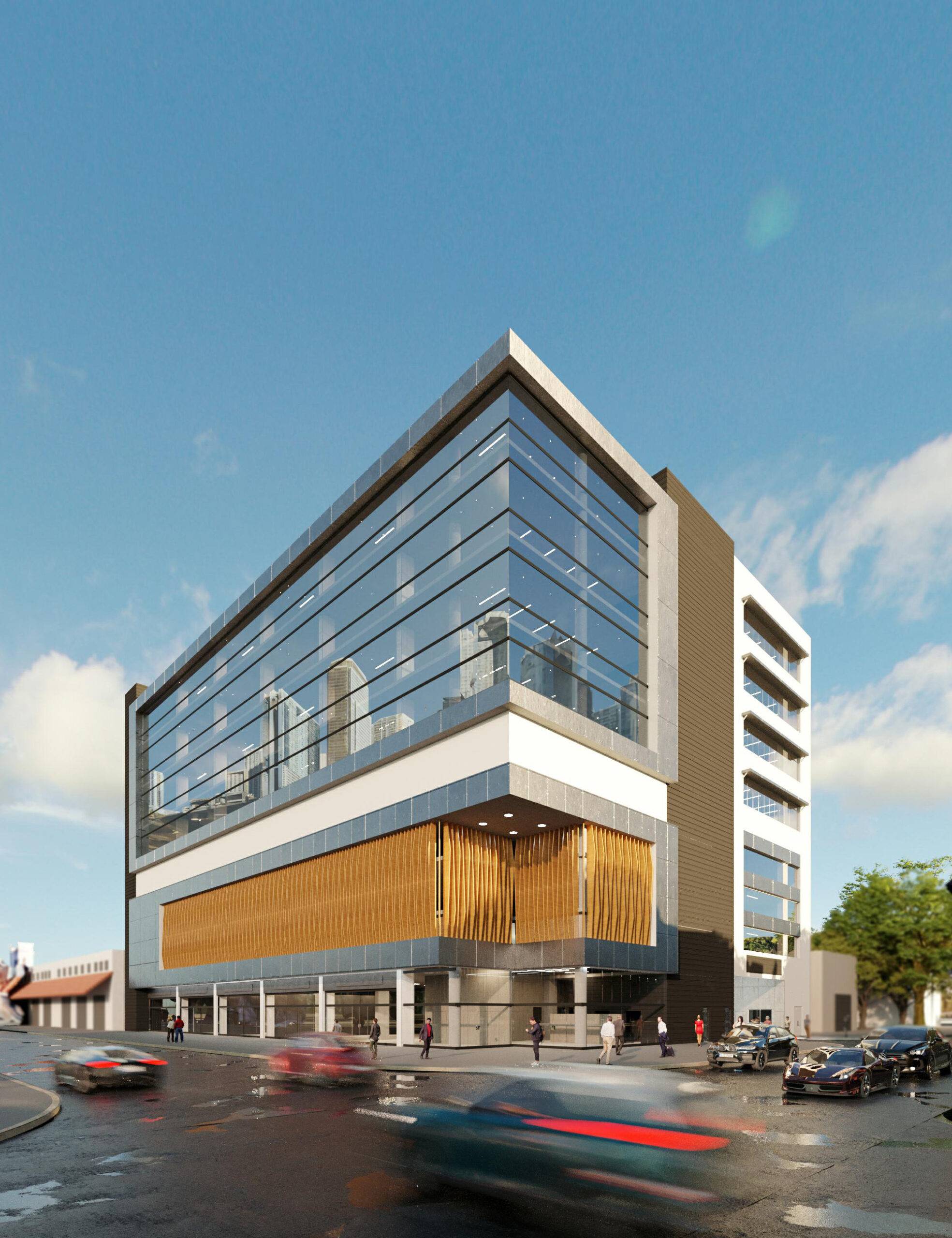 Modern glass office building with street view and cars passing by.