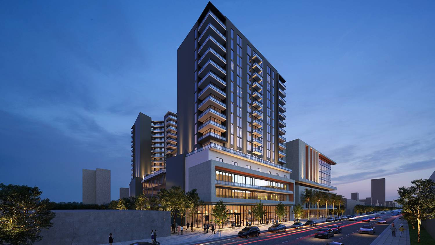 Modern urban residential building with illuminated windows and bustling street at dusk.