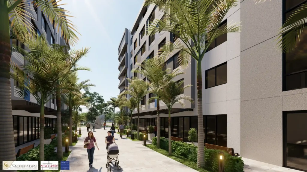 Modern urban apartment buildings with palm trees lining a sunny pedestrian pathway.