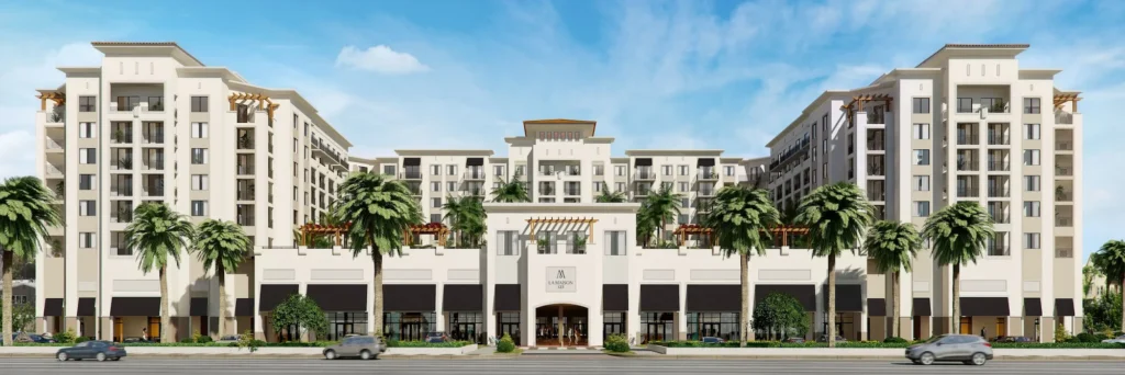 Luxury apartment complex with palm trees and clear blue sky