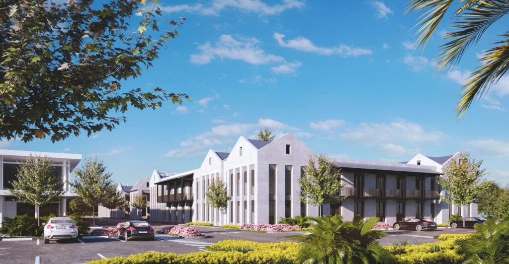 Modern architectural building with lush greenery and bright blue sky.