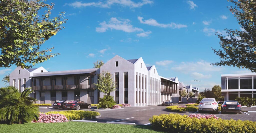 Architectural design of a modern assisted living facility with greenery and parked cars under a bright blue sky.
