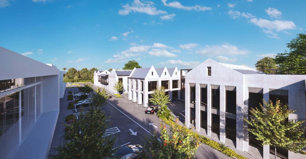 Modern architectural complex with gabled rooftops under a clear sky.