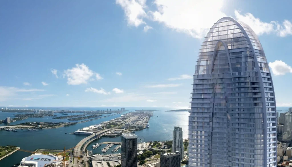 Iconic Okan Tower with ocean backdrop, showcasing modern architecture against Miami's vibrant skyline.