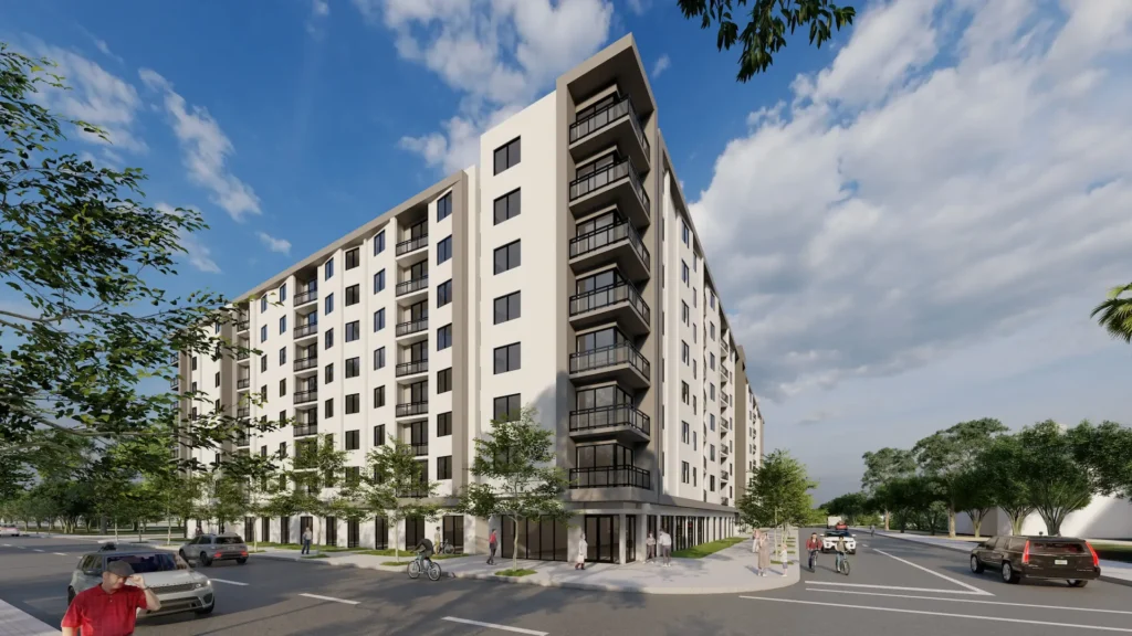 Modern multi-story apartment building with balconies against a blue sky.