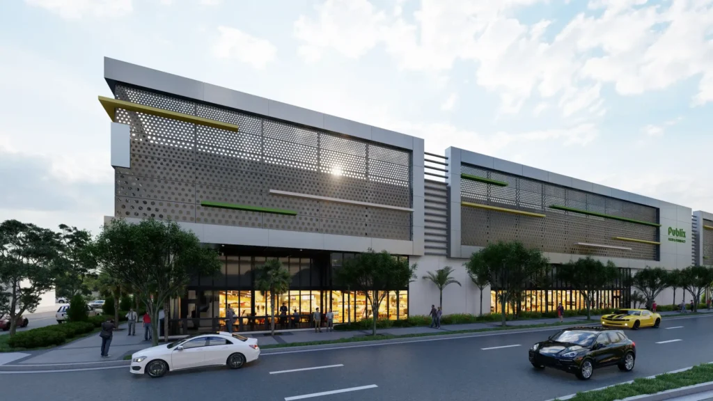 Modern retail building with sleek architecture and large windows, parked cars in the foreground.