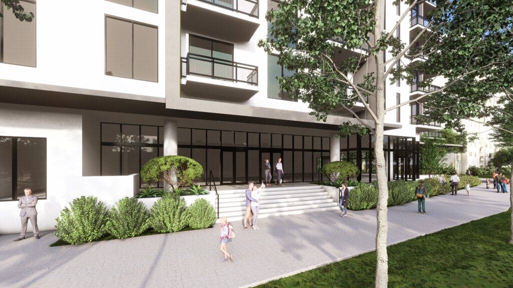 Modern apartment complex exterior with lush greenery and people walking on a sunny day.