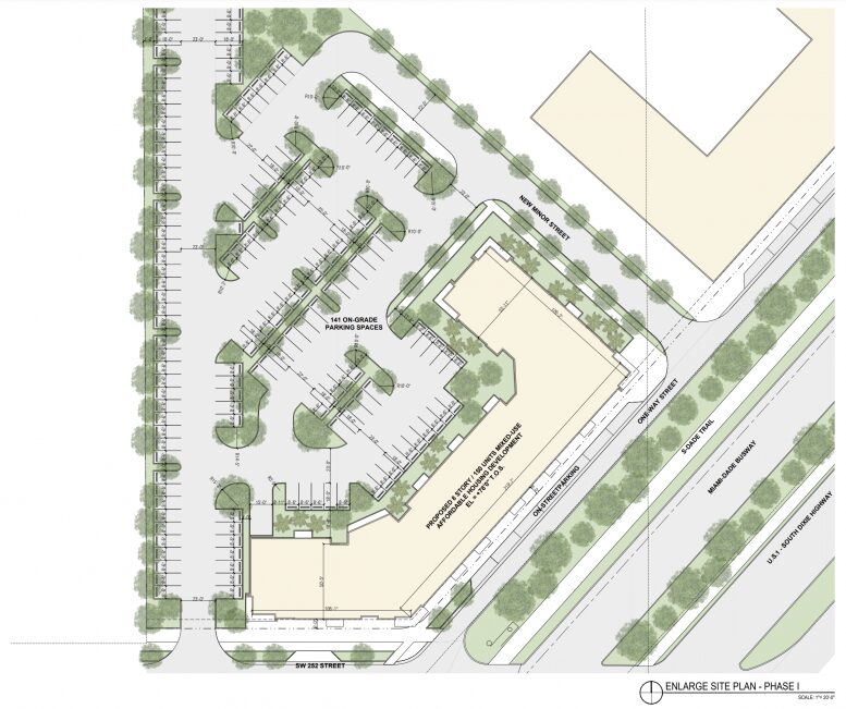 Aerial view of a detailed parking lot layout with surrounding green spaces and building plans.