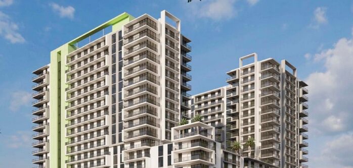 Modern high-rise building with geometric design against a blue sky