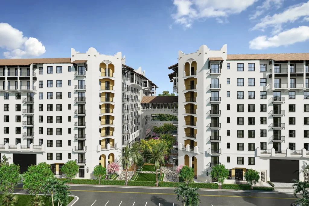 Elegant high-rise buildings with intricate architecture, lush greenery, and a clear blue sky.